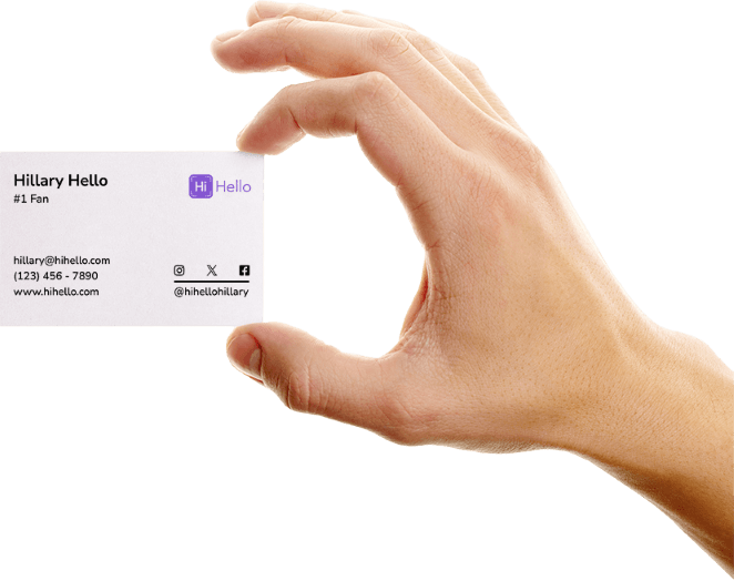 Hand holding a paper business card